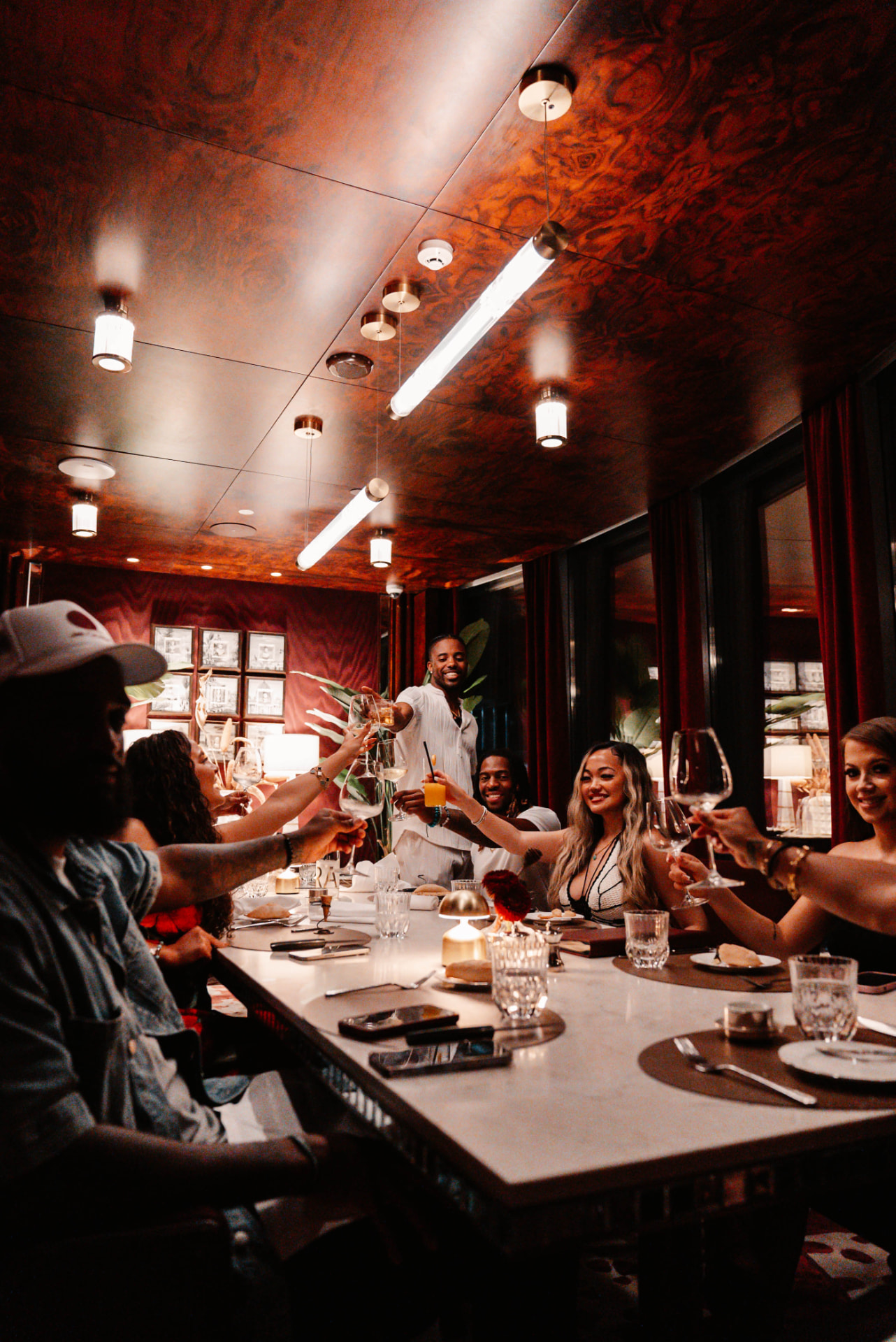 JetQuest group toasting at a signature dinner