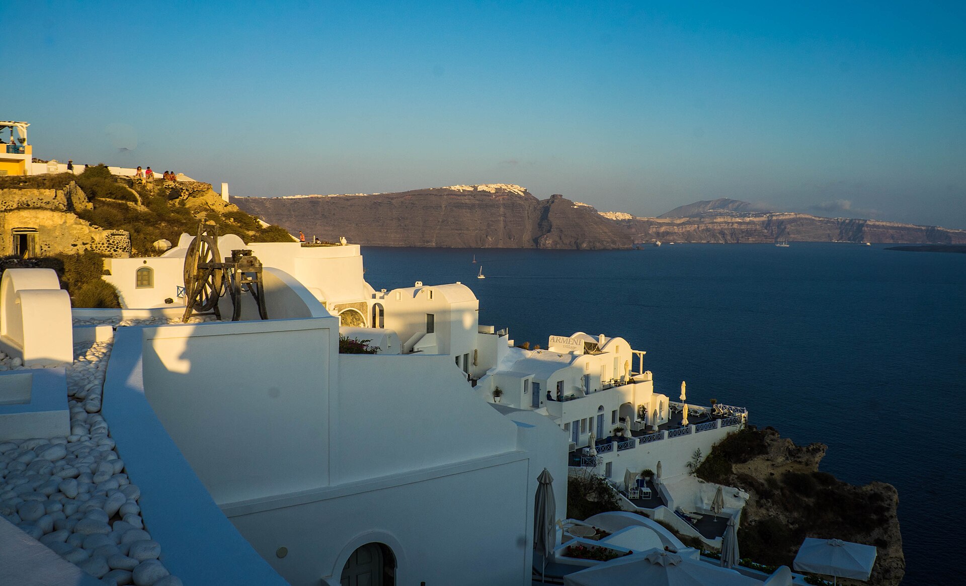 White houses and blue domes at sunset in Oia, Santorini