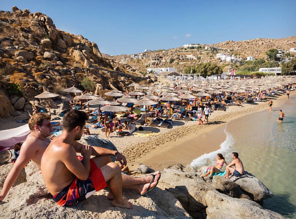 Beach and clear water on the coast of Mykonos, Greece